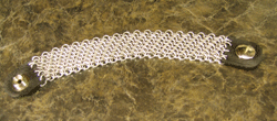 Bias weave bracelet with leather tab